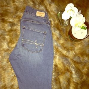 Medium wash denim Levi’s jeans.